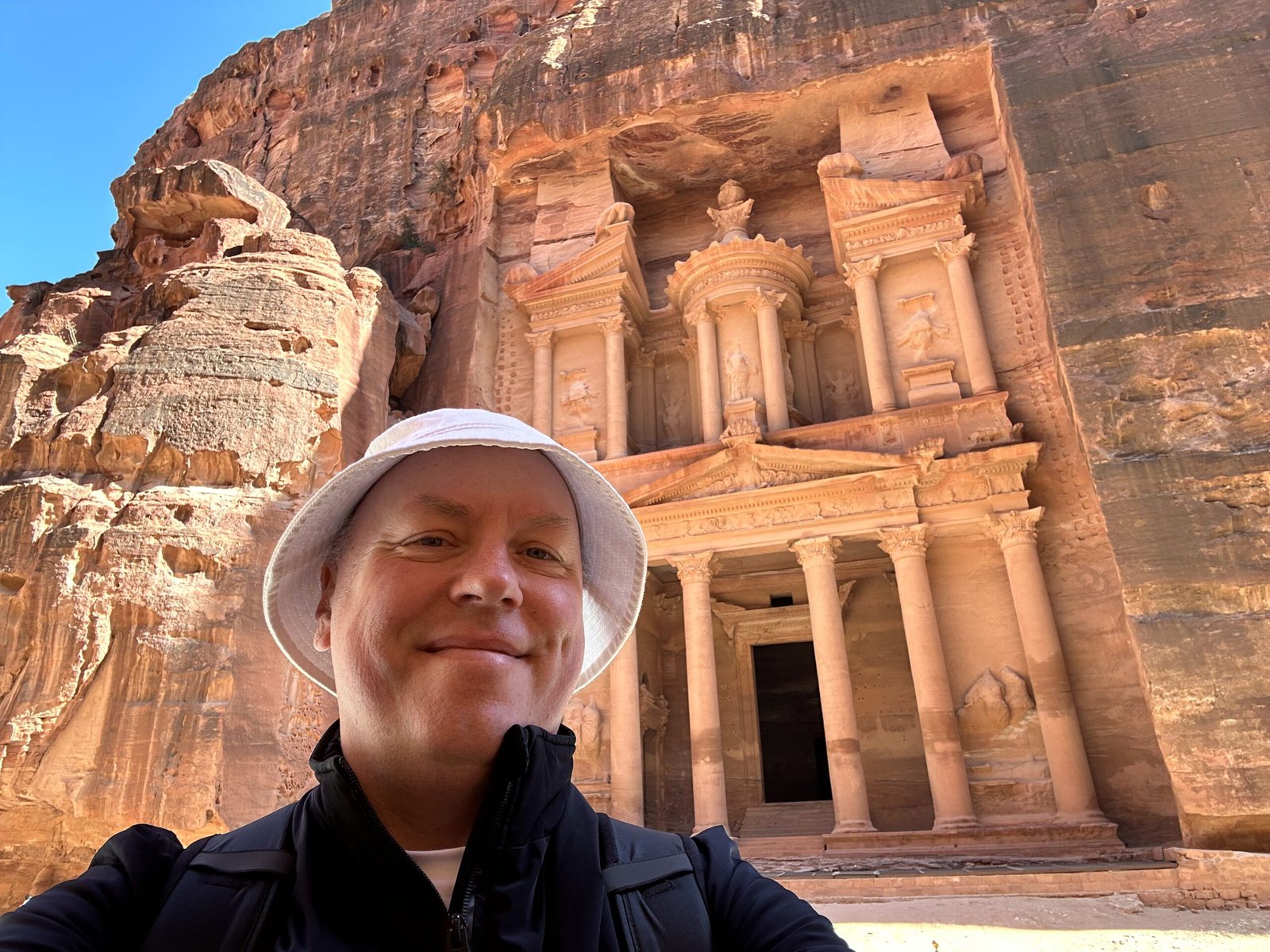 Don Trynor, author of Curious Don, standing in front of the Treasury at Petra.