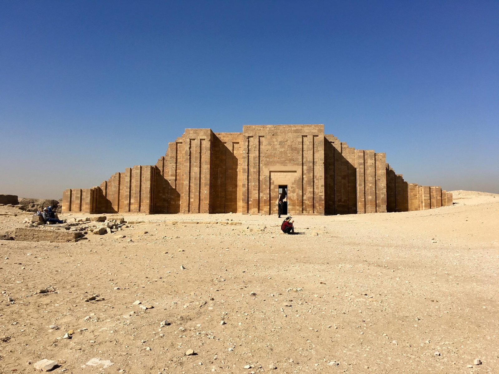 Weathered Entrance Colonnade of the Pyramid Complex of Djoser, showing signs of erosion over time.