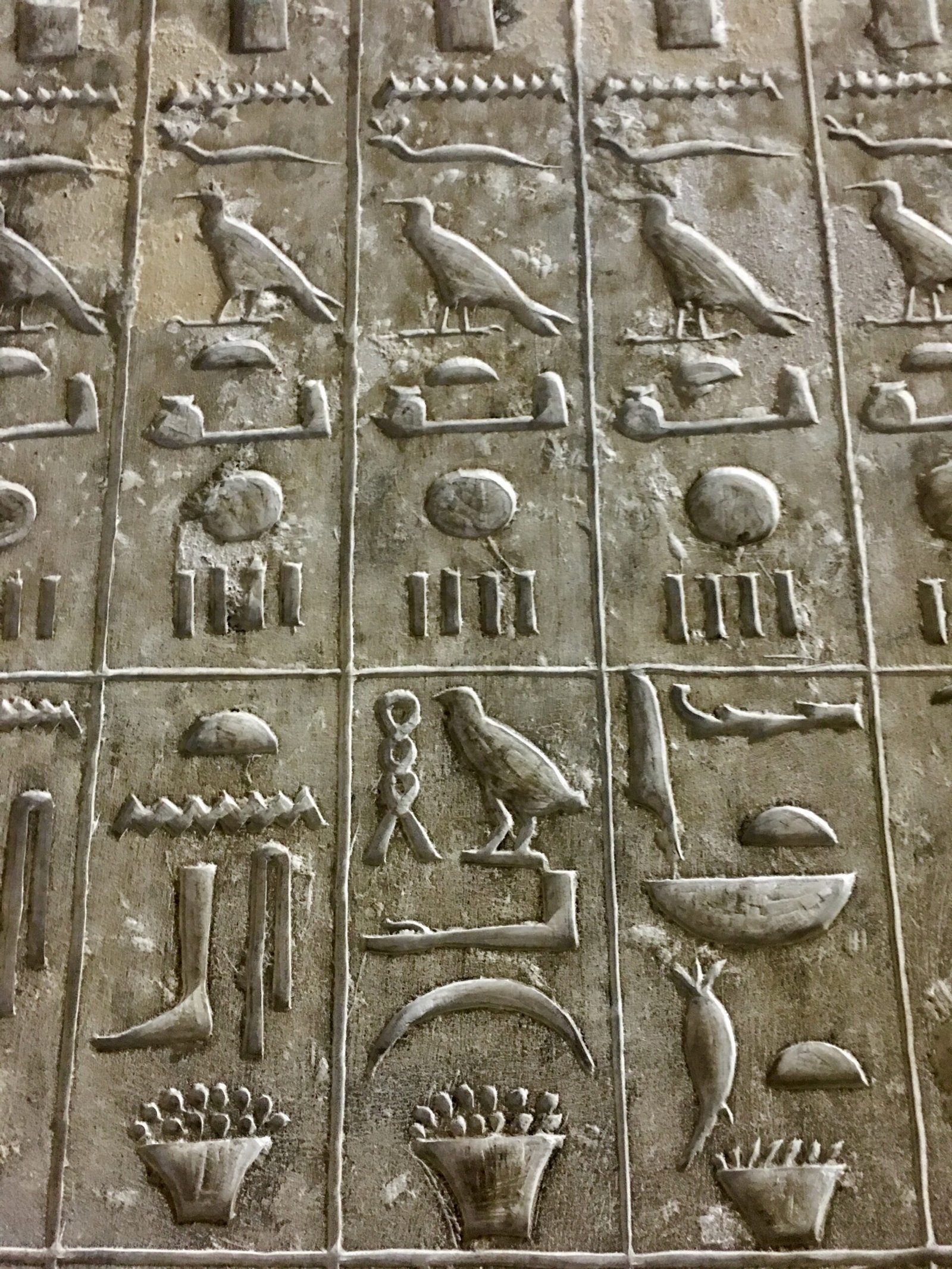 Ancient hieroglyphics on the wall inside the burial chamber of the Pyramid of Djoser in Saqqara, Egypt.