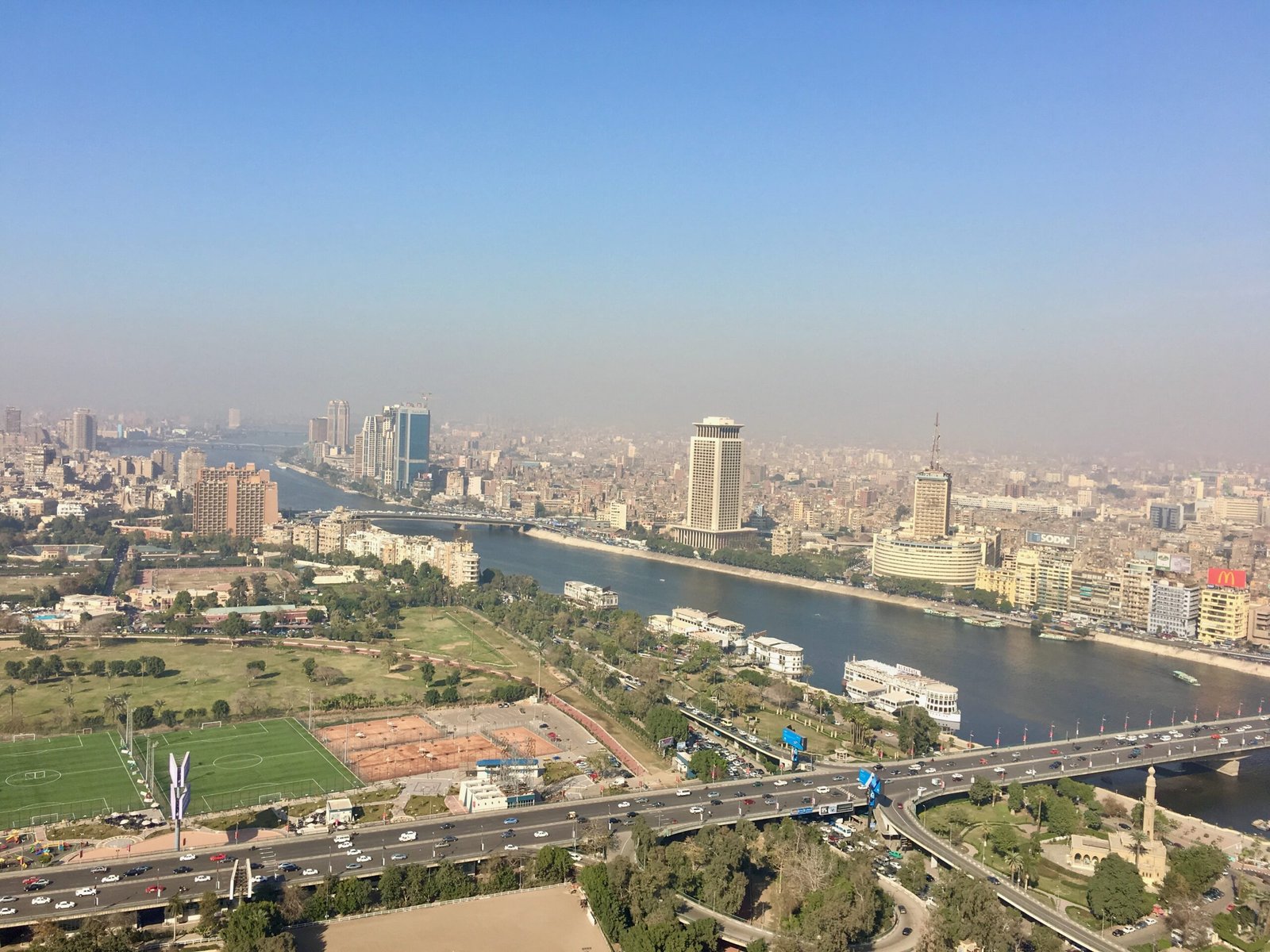 Cairo skyline view from Cairo Tower with the Nile River and 6 October Bridge in the foreground.