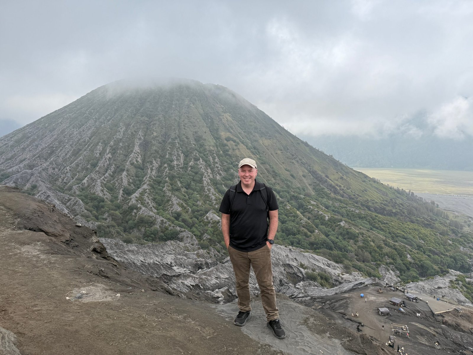 Don Trynor standing on the rim of Mount Bromo’s caldera with Mount Batok in the background.